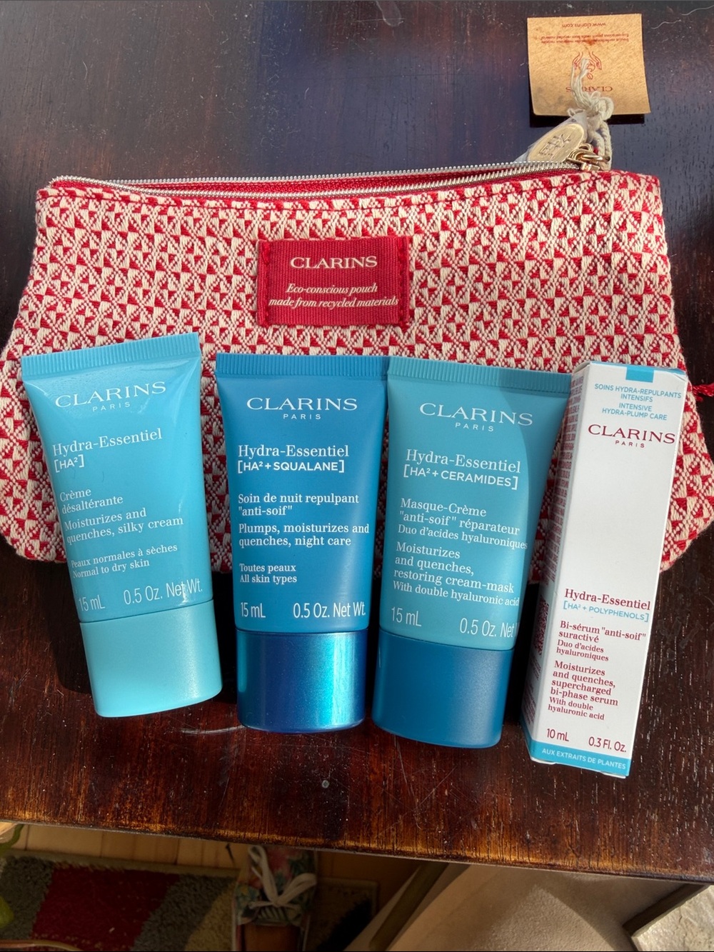Clarins Hydra‑Essentiel Mini Skincare Set in Turquoise and Red Pouch